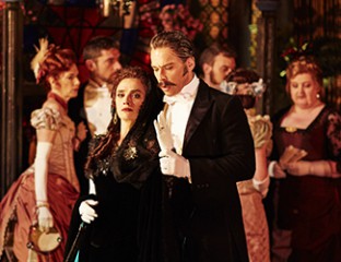Ermonela Jaho as Violetta Valéry, Adrian Tamburini as Baron Douphol and the Opera Australia Chorus in Opera Australia's production of La Traviata. Photo credit: Keith Saunders