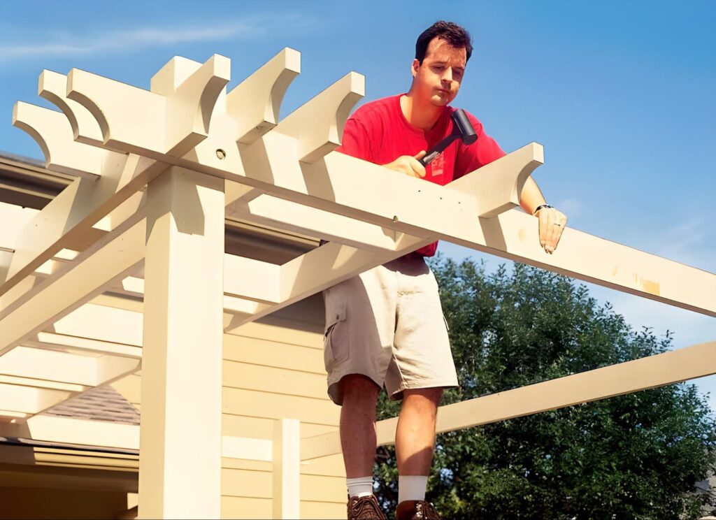 image of man building a pergola