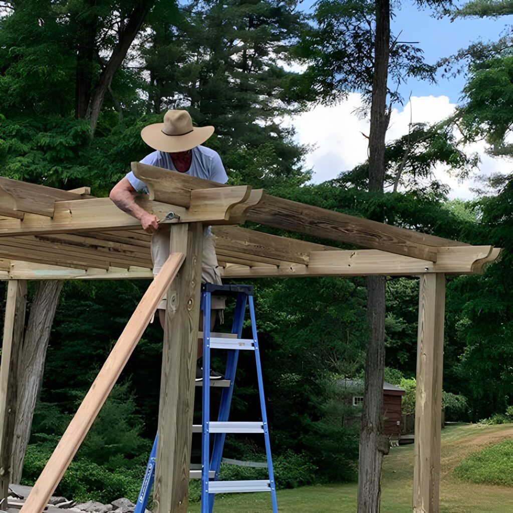 image of a man building a pergola